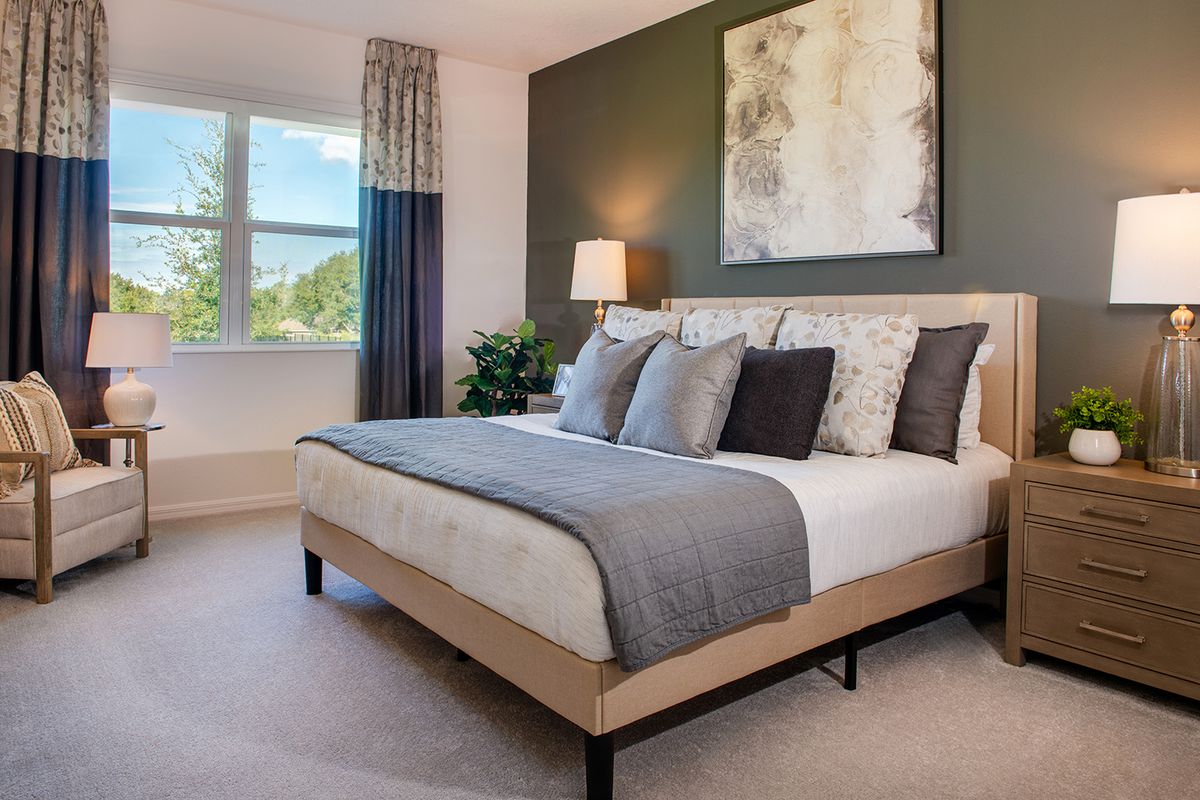 Evolve Primary Bedroom. New Homes in Tavares, FL