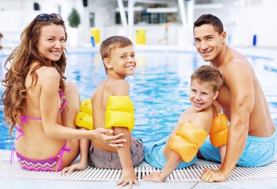 Family together pool Lifestyle. Tarpon Bay New Homes in Haines City, FL