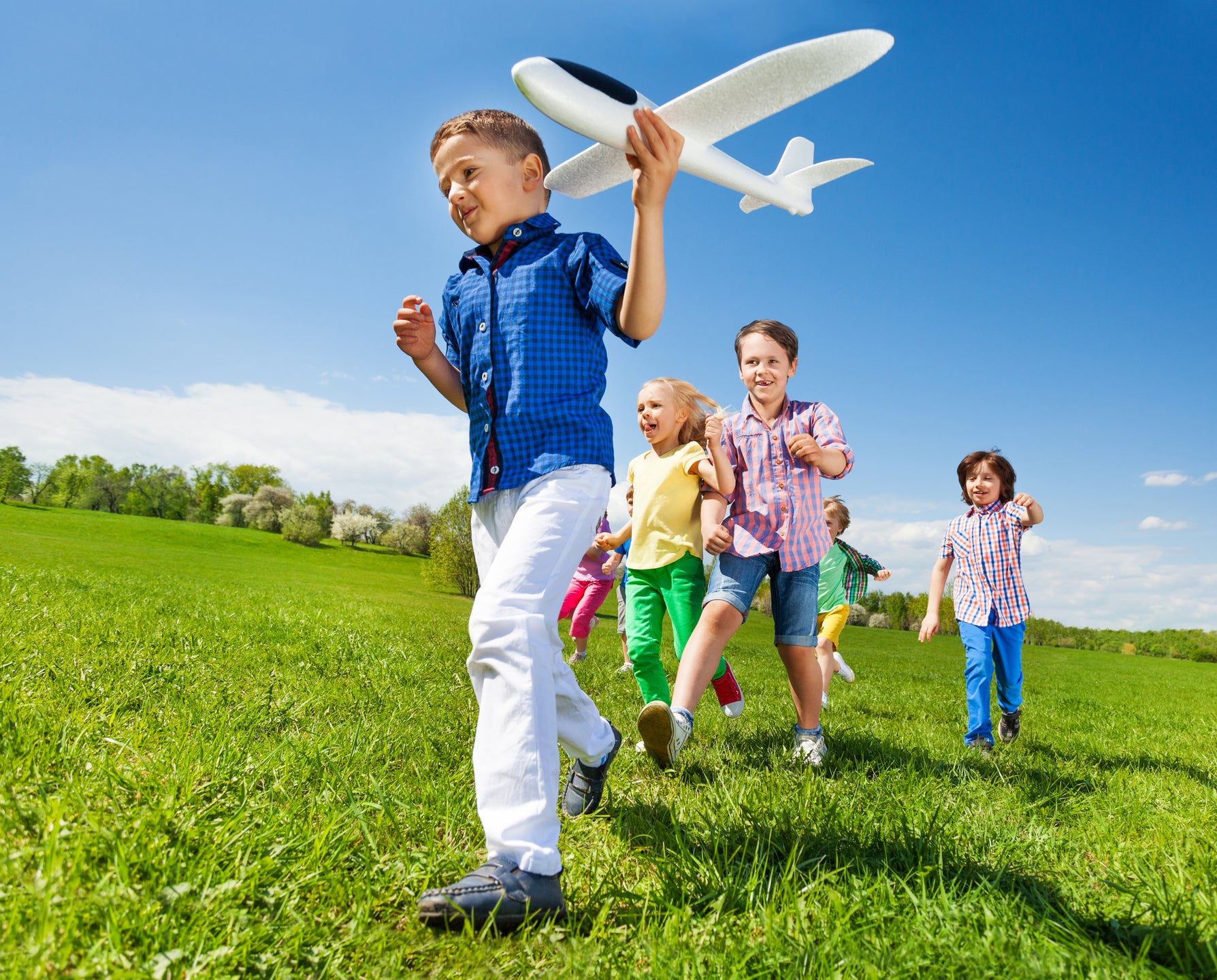 Kids running in field Lifestyle. Tarpon Bay New Homes in Haines City, FL
